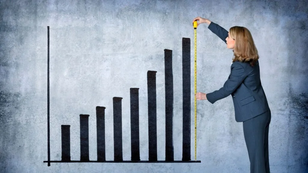 10-1 - WordPress Membership Plugin - Membership Sites Businesswoman Measures Growth With Tape Measure