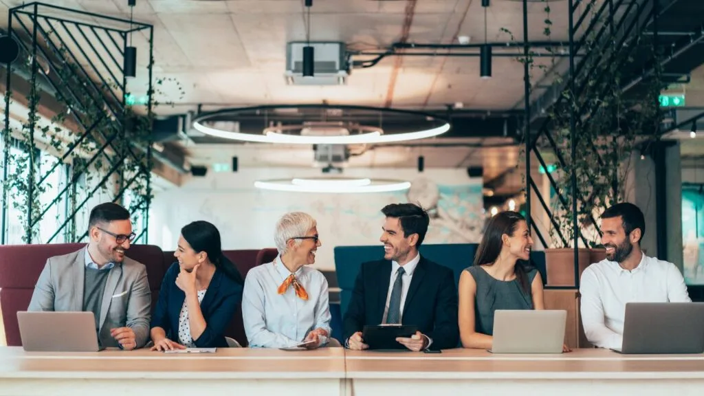 7 - WordPress Membership Plugin - Membership Sites Corporate business people talking to each other to convey the concept of networking