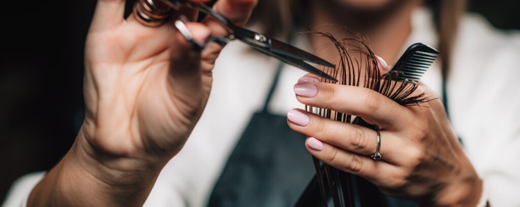 Hairdresser cutting hair