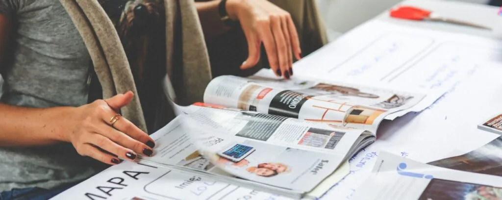 Publications - WordPress Membership Plugin - Membership Sites An editor of a magazine reviewing the layou