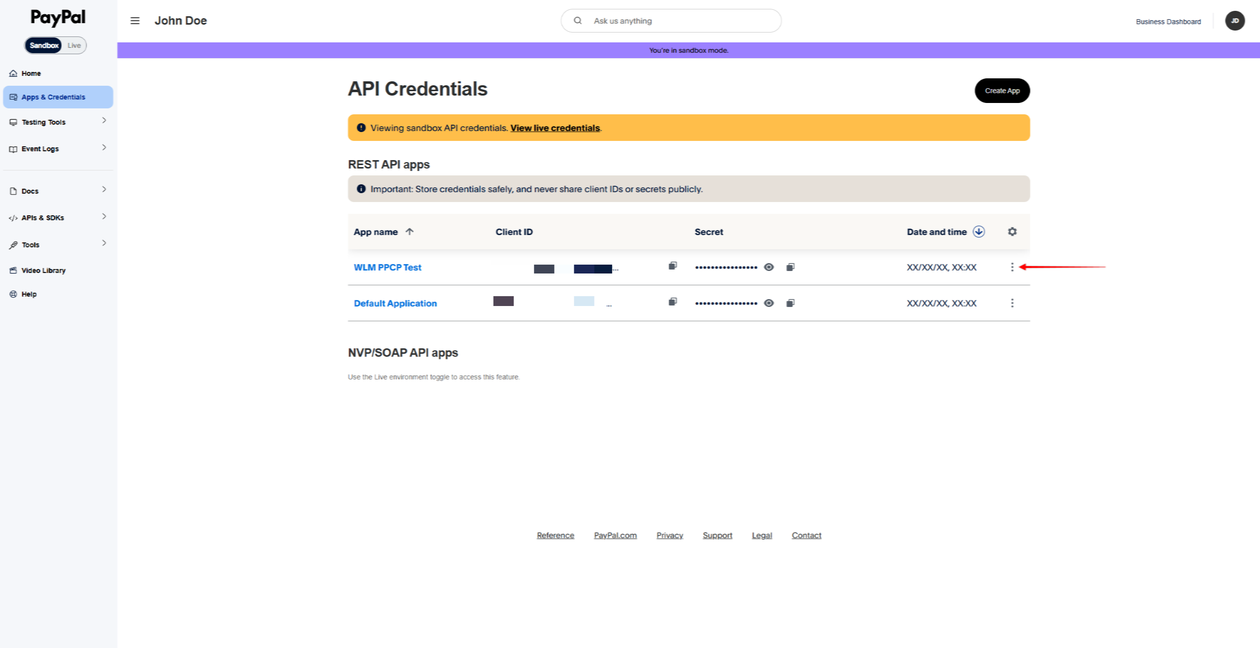 PayPal Sandbox API Credentials page with two REST API apps listed and a vertical ellipsis menu at right; left sidebar visible.