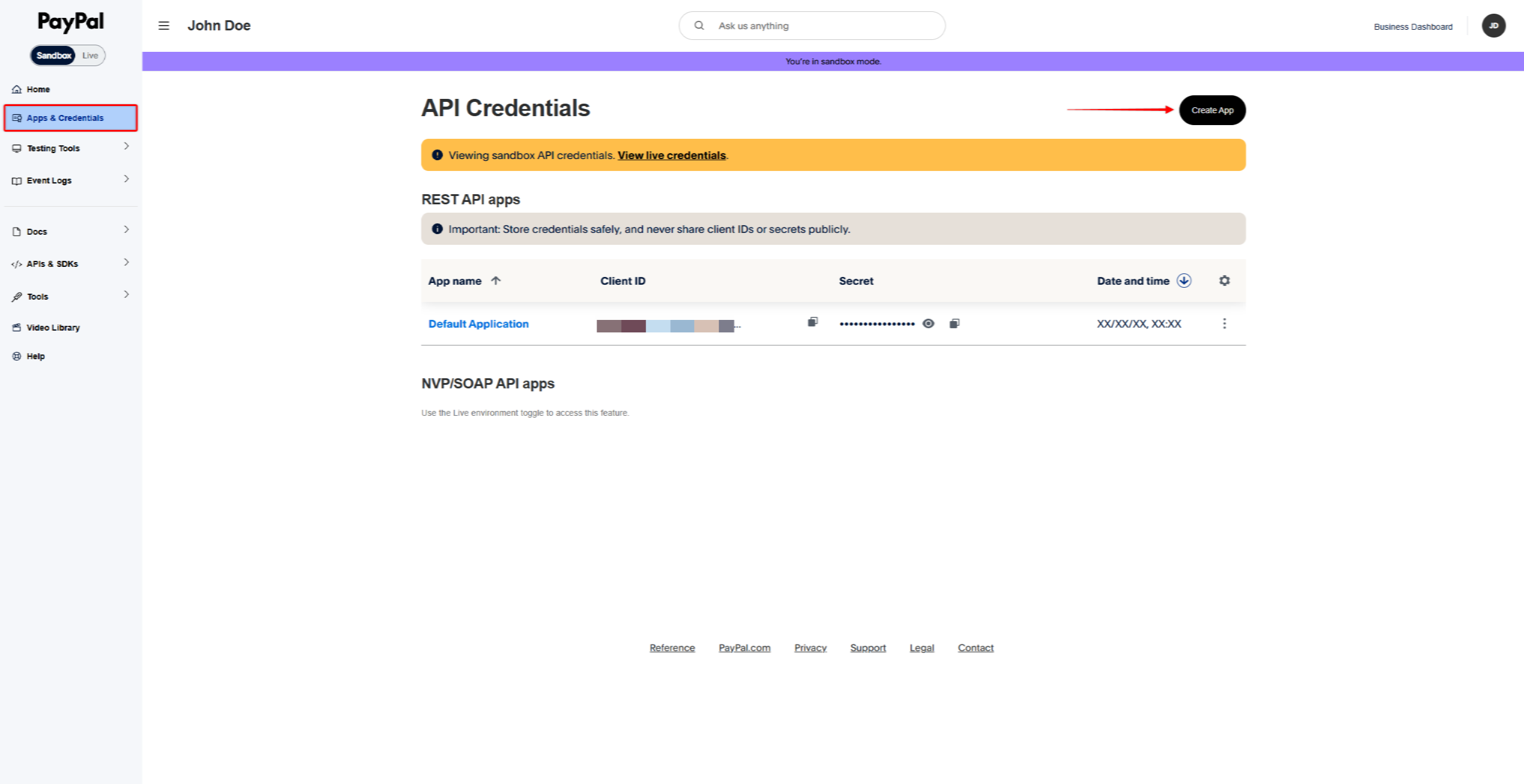 PayPal developer sandbox dashboard showing API Credentials page with a Create App button on the top right and orange info banners.